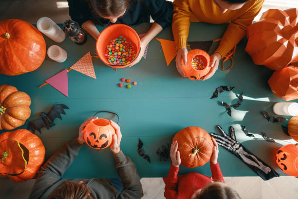 istock Happy family preparing for Halloween. 2172580575
