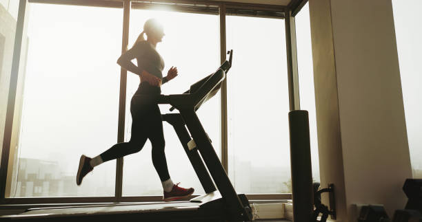 istock Active, woman and running on treadmill at gym for cardio exercise, workout and training performance. Fitness, female person and machine for morning routine, endurance and speed challenge of wellness 2172581292