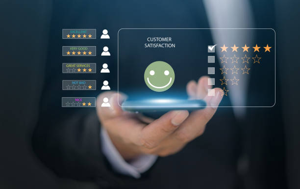 istock Customer satisfaction feedback with five star rating system, hand hold smartphone with digital smiley face quality service review, business evaluation, client experience, online review management 2172583319