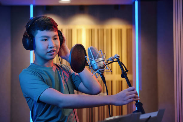 microphone dynamic for drums, standing in front of a speaker , abstract music background , professional audio