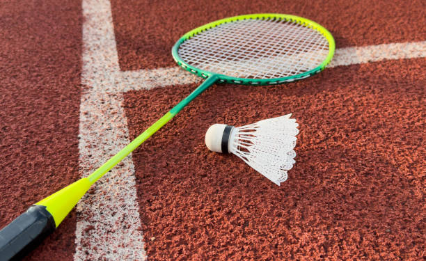 istock Cream white badminton shuttlecock and racket on badminton court, copy space, soft and selective focus. 2172588106