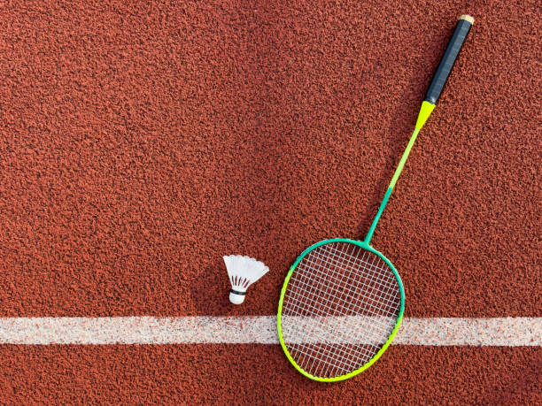 istock Cream white badminton shuttlecock and racket on badminton court, copy space, soft and selective focus. 2172588169