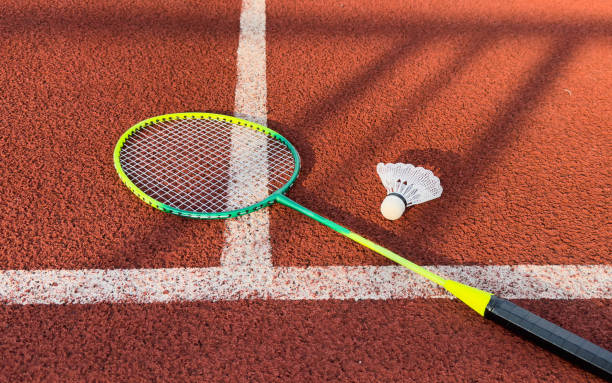 istock Cream white badminton shuttlecock and racket on badminton court, copy space, soft and selective focus. 2172588333