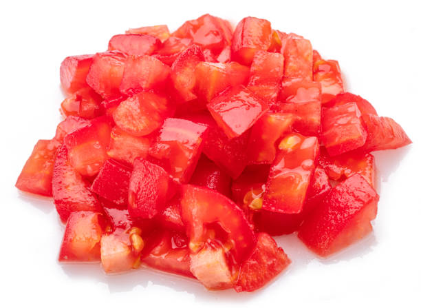 istock Peeled and diced fresh tomatoes isolated on white background. Macro shot. 2172590960
