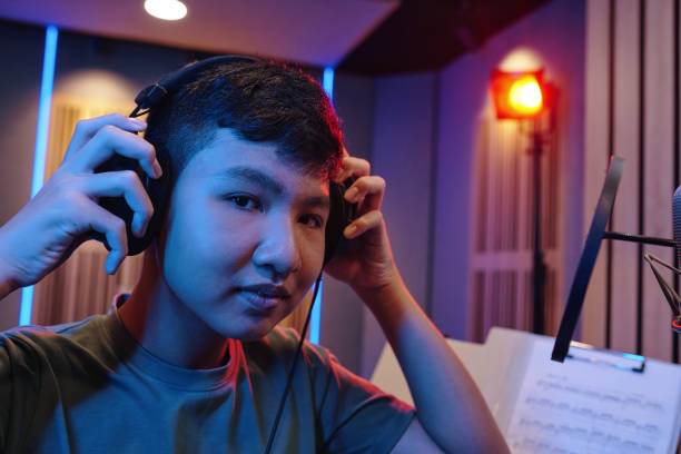 istock Adjusting Headphones in Modern Recording Studio 2172591036