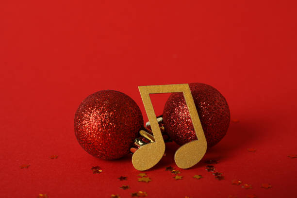 istock Golden musical notes with a ball on a red background 2172593317
