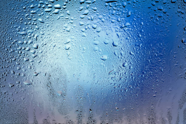 istock Raindrops on the window. Drops of water on the glass. Abstract background. Multi-colored spots. Texture of drops. 2172596085