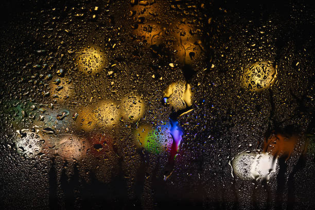 istock Raindrops on the window. Drops of water on the glass. Abstract background. Multi-colored spots. Texture of drops. 2172596294