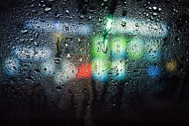 istock Raindrops on the window. Drops of water on the glass. Abstract background. Multi-colored spots. Texture of drops. 2172596595
