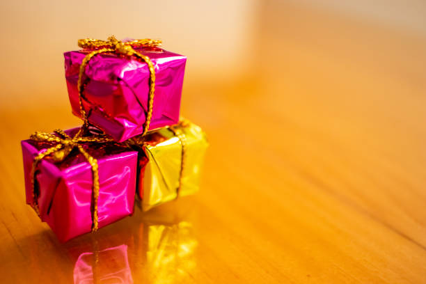 3 small gifts piled up on the table.