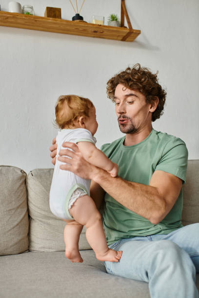 istock A joyful moment between a young father and his son at home during playful bonding time 2172599711