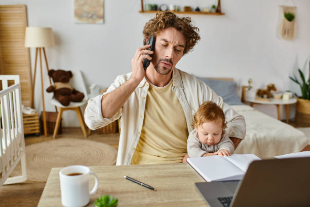 istock A young father multitasking at home while engaging with his son during a phone call 2172599904