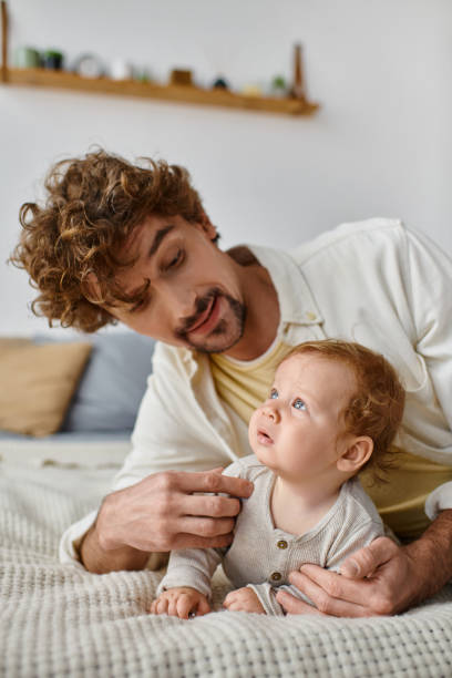 istock Young father spends quality time with his son at home, nurturing a special bond together 2172600207
