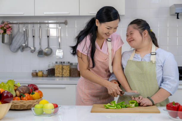 istock A mother and her child happily spending time together in the kitchen 2172602521
