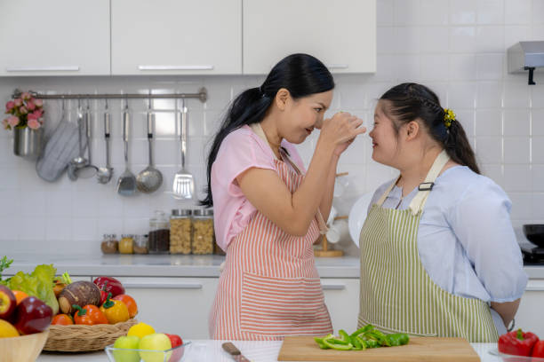 istock A mother and her child happily spending time together in the kitchen 2172602530