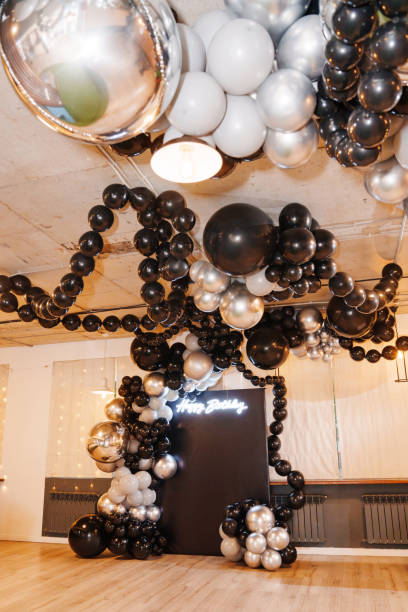 istock Festive birthday decor with silver and black balloons 2172602759