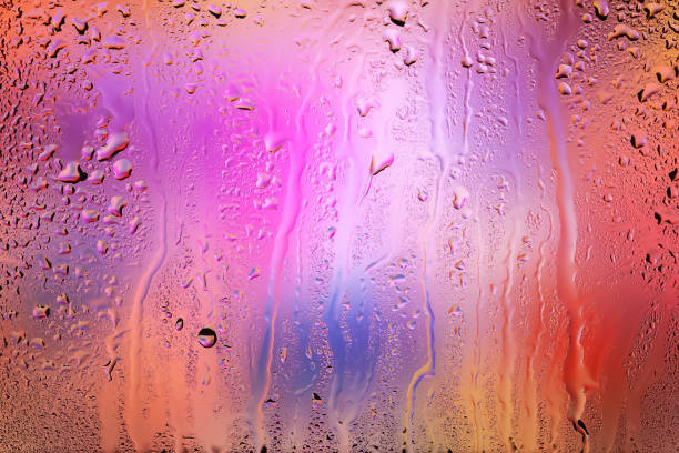 istock Raindrops on the window. Drops of water on the glass. Abstract background. Multi-colored spots. Texture of drops. 2172603555
