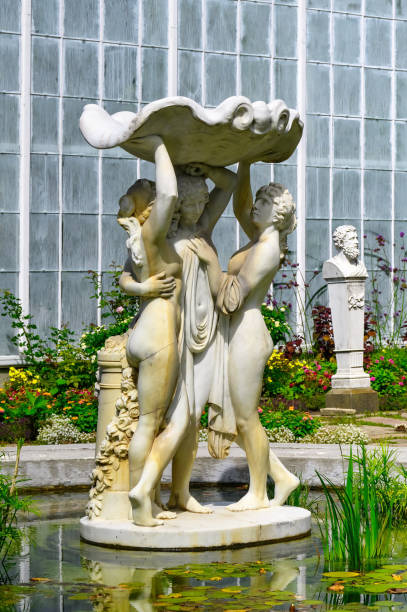 Oshawa, Canada - August 31, 2024: Stone decorative statue in a fountain located in the gardens of the Parkwood Estate - a National Historic Site of Canada