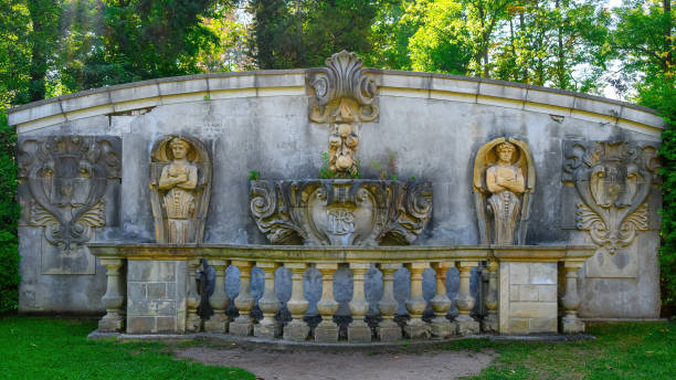 Scarborough, Canada - September 29, 2024: Ancient stone wall with statues as decorations in Guild Park and Gardens. The public park exhibits ruins of colonial demolished buildings in the city.