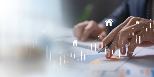 istock Analyzing Real Estate Market Trends concept. Business professional analyzing real estate data with digital graphs and house icons, indicating market trends, investment, and property growth. 2172614931