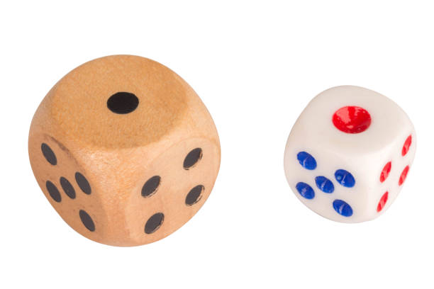 Close up of two dice on a wooden table