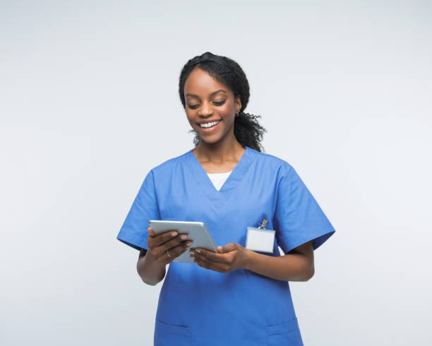 istock Portrait of friendly nurse using digital tablet 2172618054