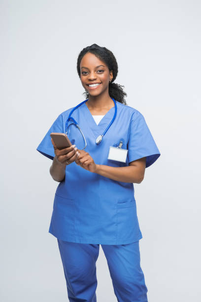istock Portrait of friendly nurse using smart phone 2172618130