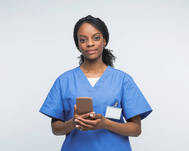 istock Portrait of friendly nurse using smart phone 2172618214
