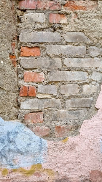 istock Peeling paint on an old wall. Grunge background for design.Selective focus 2172619370