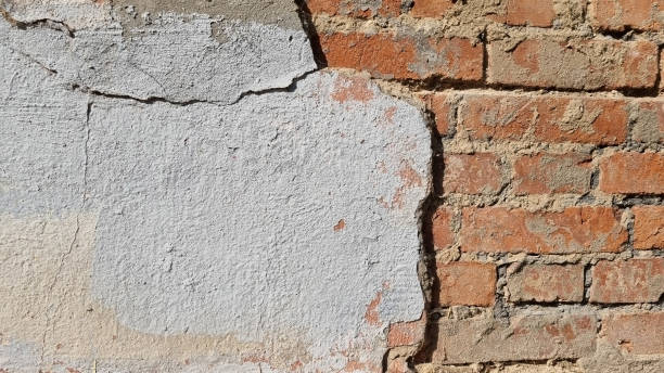 istock Peeling paint on an old wall. Grunge background for design.Selective focus 2172619920