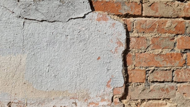 istock Peeling paint on an old wall. Grunge background for design.Selective focus 2172619957