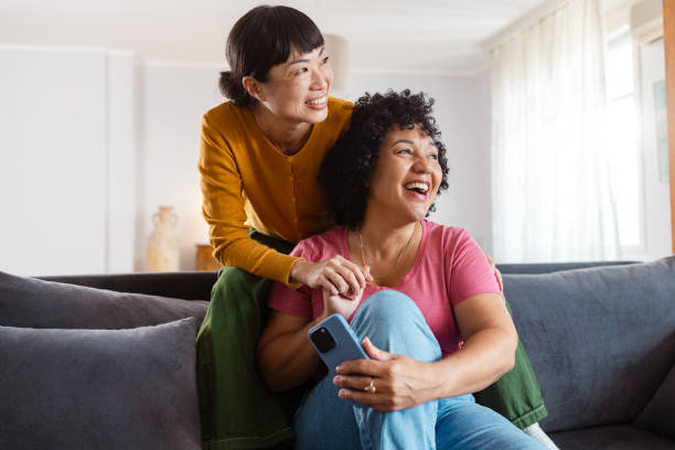 istock Cheerful diverse lesbian couple at home smiling 2172620671