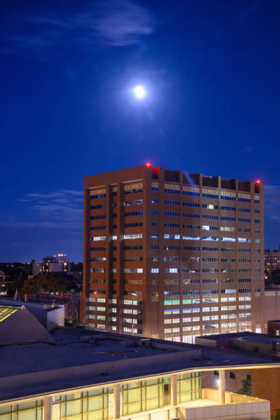 istock Moon rising over the city buildings 2172622678
