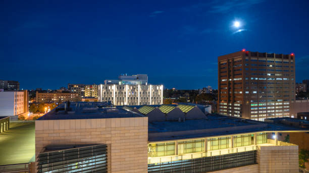 istock Moon rising over the city buildings 2172622679