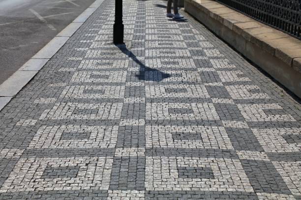 istock Sidewalk cobblestone pavement patterns in Prague city 2172625914