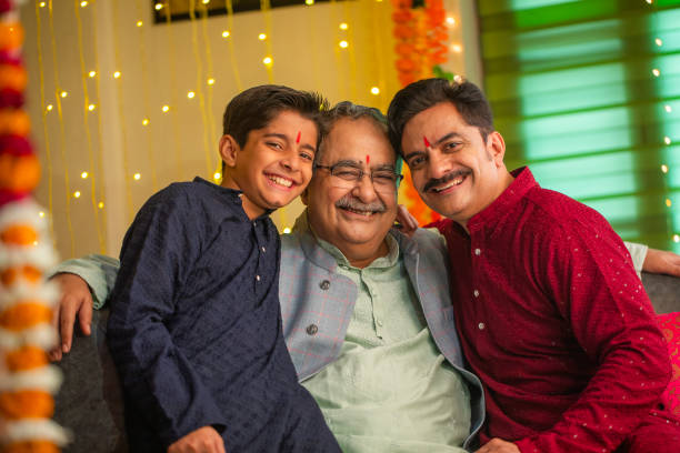 istock Happy multi-generation family sitting on sofa at home during Diwali 2172627567