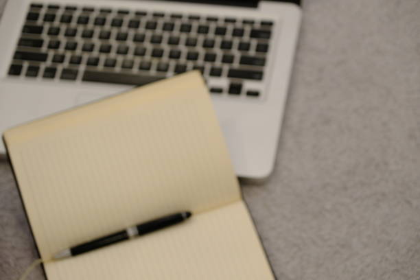 The business laptop and notebook for business. Meeting notes and working computer.new business life