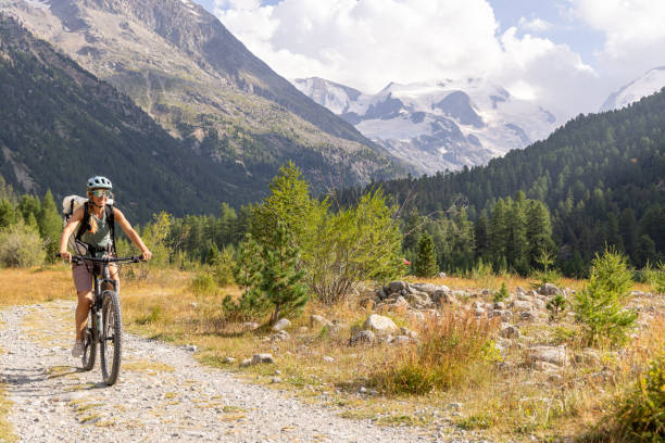 istock Cyclist Riding Along Scenic Mountain Trail 2172636131