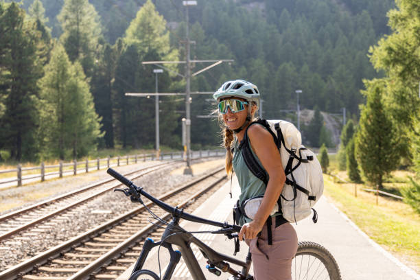 istock Cyclist Waiting at Train Station in Mountainous Area 2172636186