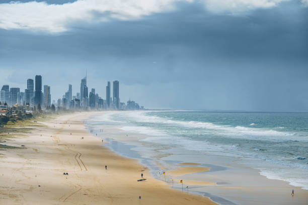 Explore the breathtaking aerial view of the beach, Pacific Ocean, and skyscrapers at Gold Coast, Australia. This stunning image captures the vibrant coastal city, blending natural beauty with urban sophistication.