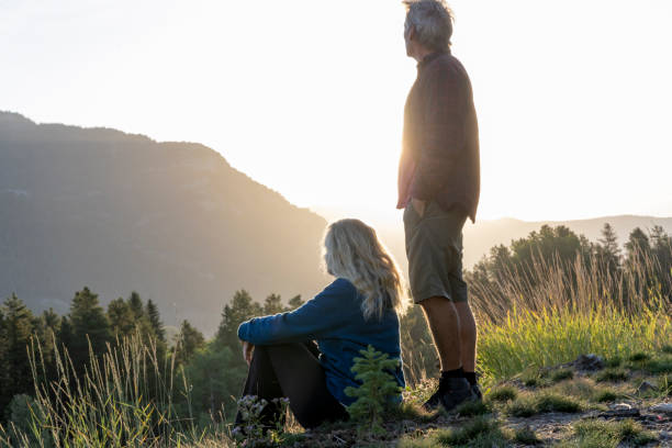 istock Mature couple watch sunset over mountains 2172637111
