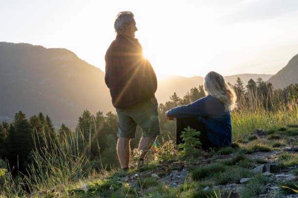 istock Mature couple watch sunset over mountains 2172637115