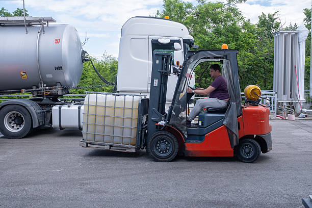 istock A forklift driver carries a 1000 Litre IBC Bulk Container. 2172637141