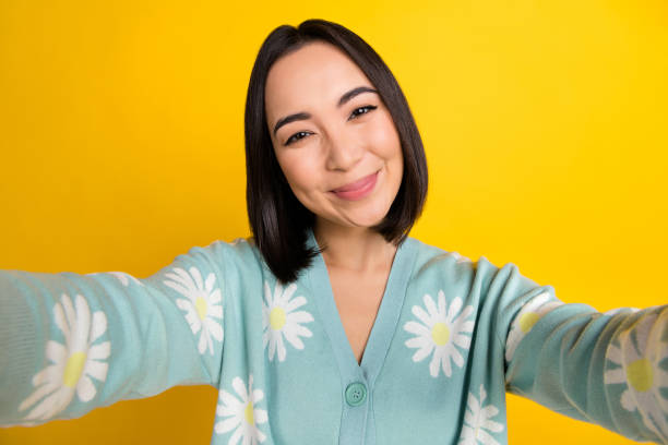 istock Photo of optimistic satisfied pleasant woman with bob hairstyle dressed blue pullover doing selfie isolated on yellow color background 2172640896