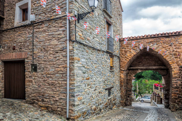 Exploring Puerta Del Rio Archway in Yanguas, Soria, Spain on a Cloudy Day