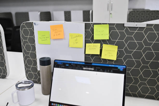 istock Office Desk with Open Laptop and colourful post-its 2172641652