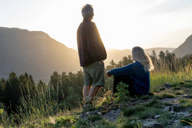 istock Mature couple watch sunset over mountains 2172643973
