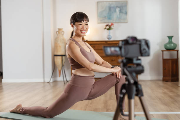 istock Filming a yoga session for social media content 2172647019