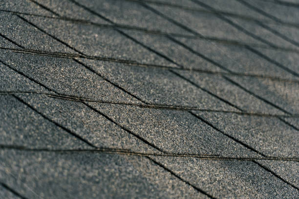 Wooden roof shingles (larch) dampened by rain background