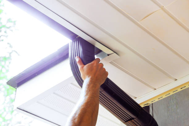 istock It is being assembled by handyman along with installation of gutter channels attached to a roof 2172651981